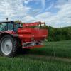Tractor and fertiliser spreader